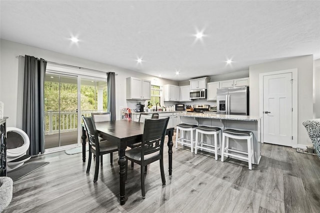 329 Nelson Dr, Monroeville, PA 15146 - dining space with light wood-style floors and recessed lighting