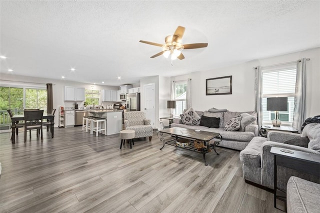 329 Nelson Dr, Monroeville, PA 15146 - living room featuring light wood-style flooring, ceiling fan, recessed lighting, and a textured ceiling