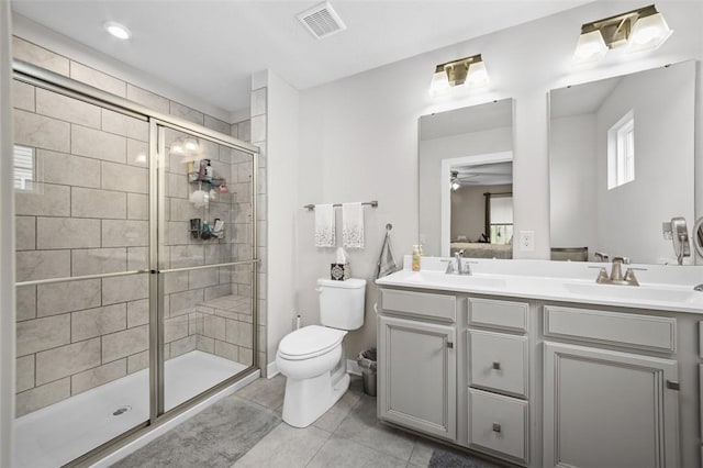 329 Nelson Dr, Monroeville, PA 15146 - bathroom featuring double vanity, a stall shower, ceiling fan, and tile patterned flooring