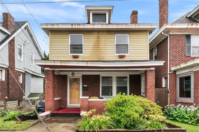 1477 Benton Ave, Brighton Heights, PA 15212 - american foursquare style home featuring a porch and brick siding