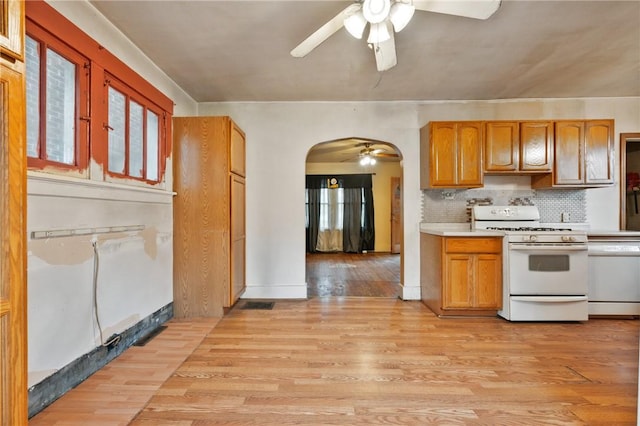 1477 Benton Ave, Brighton Heights, PA 15212 - kitchen featuring white appliances, arched walkways, a ceiling fan, and light countertops