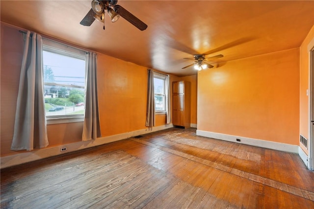 1477 Benton Ave, Brighton Heights, PA 15212 - unfurnished room with a ceiling fan, wood-type flooring, and healthy amount of natural light
