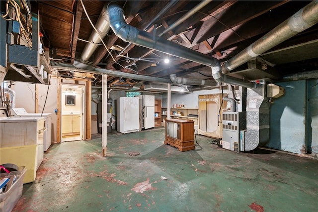 1477 Benton Ave, Brighton Heights, PA 15212 - unfinished below grade area with separate washer and dryer, freestanding refrigerator, and heating unit