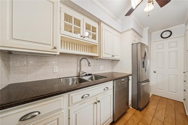 53 Highland Rd Unit 403-404, Bethel Park, PA 15102 - kitchen featuring appliances with stainless steel finishes, light wood-style flooring, crown molding, ceiling fan, and decorative backsplash