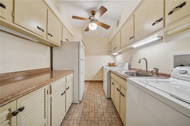 53 Highland Rd Unit 403-404, Bethel Park, PA 15102 - kitchen with washer / dryer, cream cabinets, and a ceiling fan