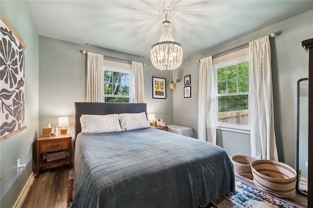 1021 Beechnut St, West Deer, PA 15084 - bedroom with multiple windows, wood finished floors, and a chandelier