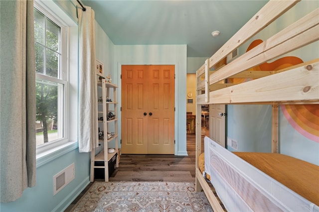 1021 Beechnut St, West Deer, PA 15084 - unfurnished bedroom featuring wood finished floors and multiple windows