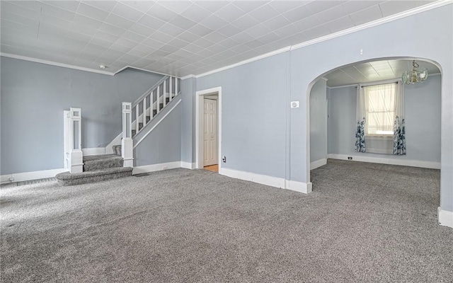 112 Fisk Ave, Avalon, PA 15202 - unfurnished living room featuring arched walkways, ornamental molding, carpet floors, a chandelier, and stairs
