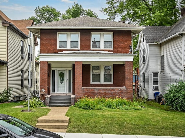 112 Fisk Ave, Avalon, PA 15202 - traditional style home with brick siding, a front lawn, and a shingled roof