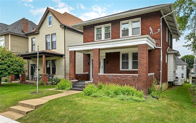 112 Fisk Ave, Avalon, PA 15202 - traditional style home featuring covered porch, brick siding, and a front yard