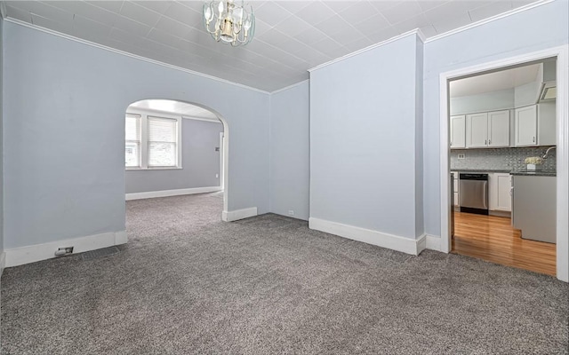 112 Fisk Ave, Avalon, PA 15202 - spare room with ornamental molding, carpet, and arched walkways