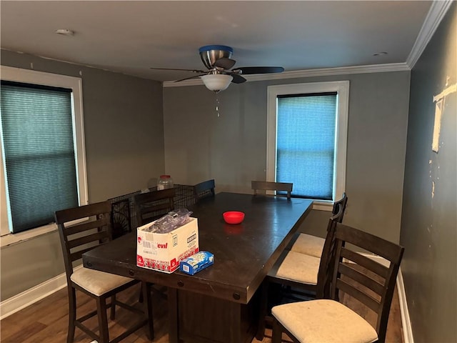 1119 Stewart St, Tarentum, PA 15084 - dining room featuring a ceiling fan, wood finished floors, and crown molding