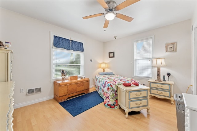 332 S Chestnut St, Scottdale, PA 15683 - bedroom with multiple windows, light wood finished floors, and a ceiling fan