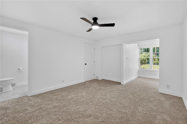 235 Telegraph Rd, Luzerne Twp, PA 15417 - unfurnished bedroom featuring ensuite bath, carpet floors, and ceiling fan