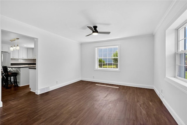235 Telegraph Rd, Luzerne Twp, PA 15417 - empty room with healthy amount of natural light, ceiling fan, ornamental molding, and dark wood-type flooring