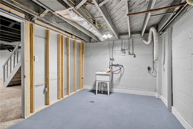 235 Telegraph Rd, Luzerne Twp, PA 15417 - unfinished basement featuring concrete block wall and stairway