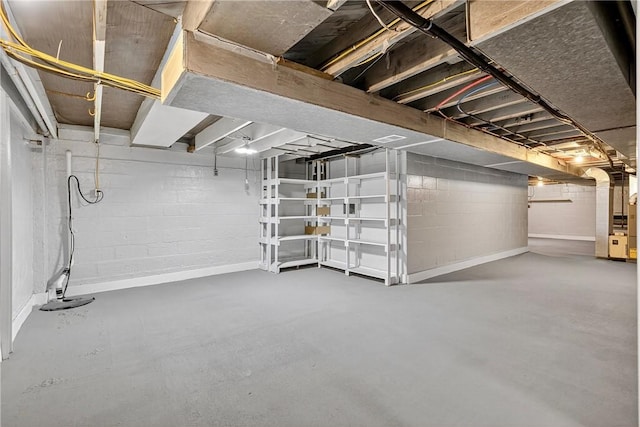 235 Telegraph Rd, Luzerne Twp, PA 15417 - unfinished basement featuring heating unit and concrete block wall