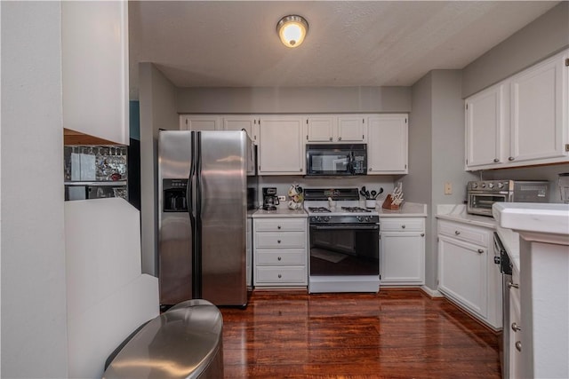 115 Westbrooke Ln, Findlay Twp, PA 15108 - kitchen with stainless steel refrigerator with ice dispenser, gas range, black microwave, white cabinetry, and dark wood finished floors