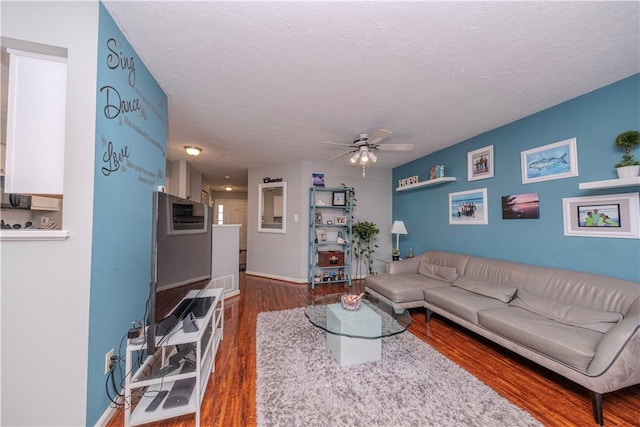 115 Westbrooke Ln, Findlay Twp, PA 15108 - living area featuring a ceiling fan, wood finished floors, and a textured ceiling