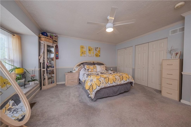 115 Westbrooke Ln, Findlay Twp, PA 15108 - bedroom featuring multiple closets, a textured ceiling, carpet flooring, ornamental molding, and a ceiling fan