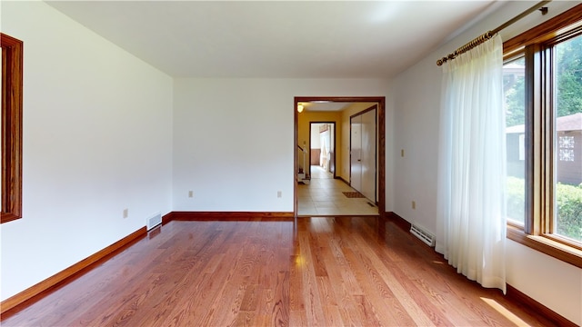 8410 Windsor Beach Ct, Harborcreek Twp, PA 16511 - unfurnished room with healthy amount of natural light and light wood-style flooring