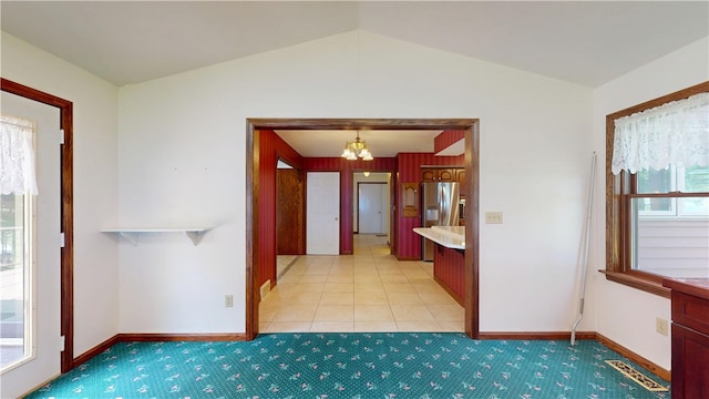 8410 Windsor Beach Ct, Harborcreek Twp, PA 16511 - kitchen featuring a chandelier, light carpet, lofted ceiling, stainless steel refrigerator with ice dispenser, and light countertops