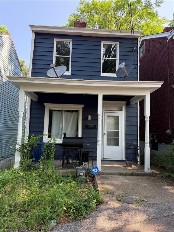 1336 Complete St, Marshall Shadeland, PA 15212 - view of front facade with a porch and a chimney