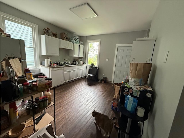 1336 Complete St, Marshall Shadeland, PA 15212 - kitchen with white dishwasher, white cabinets, light countertops, and dark wood finished floors