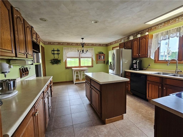 323 Hoon Rd, Oakland Twp, PA 16001 - kitchen with black dishwasher, stainless steel refrigerator with ice dispenser, a center island, light countertops, and a chandelier