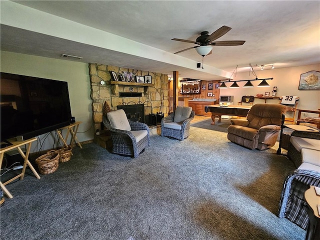 323 Hoon Rd, Oakland Twp, PA 16001 - carpeted living area featuring a stone fireplace and a ceiling fan
