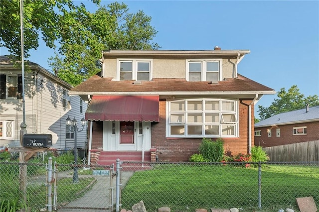 357 Keystone Dr, New Kensington, PA 15068 - view of front of property with brick siding, a gate, and a fenced front yard