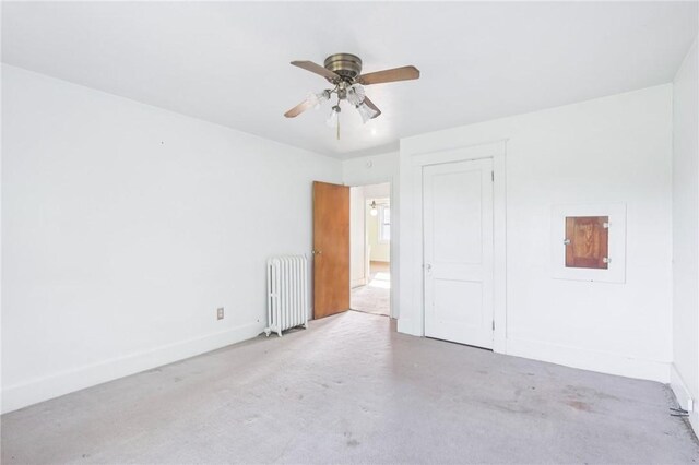 357 Keystone Dr, New Kensington, PA 15068 - unfurnished room featuring radiator heating unit, ceiling fan, and carpet