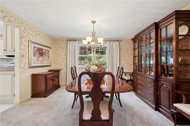 511 Brunswick Dr, Hempfield Twp, PA 15601 - dining room with a chandelier, wallpapered walls, light colored carpet, a textured ceiling, and wainscoting