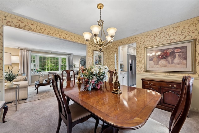511 Brunswick Dr, Hempfield Twp, PA 15601 - dining room with wallpapered walls, a chandelier, light colored carpet, and crown molding