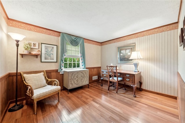 511 Brunswick Dr, Hempfield Twp, PA 15601 - office with wood-type flooring, wainscoting, a textured ceiling, wallpapered walls, and ornamental molding