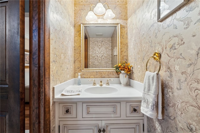 511 Brunswick Dr, Hempfield Twp, PA 15601 - bathroom with wallpapered walls and vanity