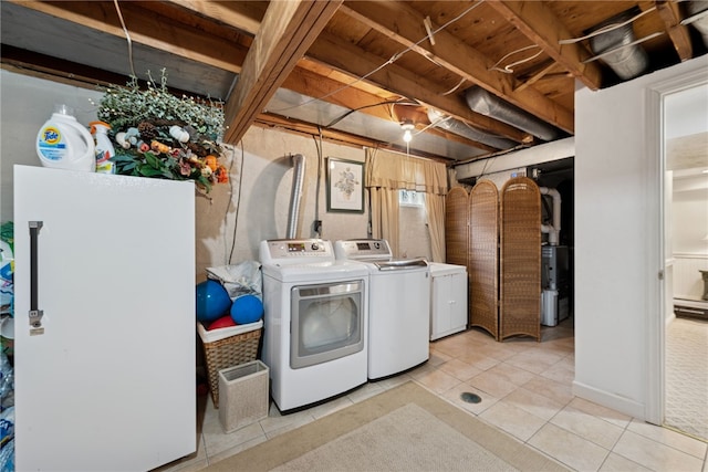 511 Brunswick Dr, Hempfield Twp, PA 15601 - laundry room featuring separate washer and dryer and light tile patterned flooring