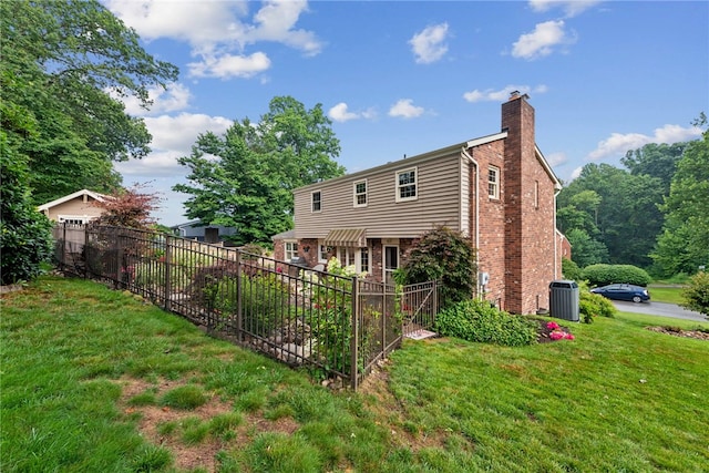 511 Brunswick Dr, Hempfield Twp, PA 15601 - rear view of house with brick siding and a chimney