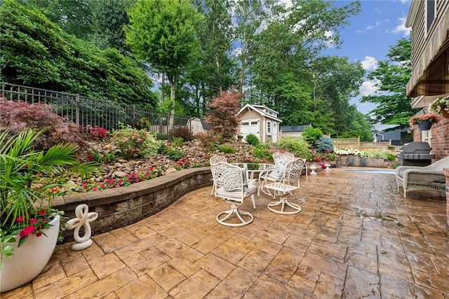 511 Brunswick Dr, Hempfield Twp, PA 15601 - view of patio / terrace featuring outdoor dining area, a storage shed, and grilling area