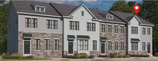 121 Quail Run Rd Unit 13, Peters Twp, PA 15367 - view of front of property featuring stone siding, board and batten siding, a standing seam roof, and a metal roof