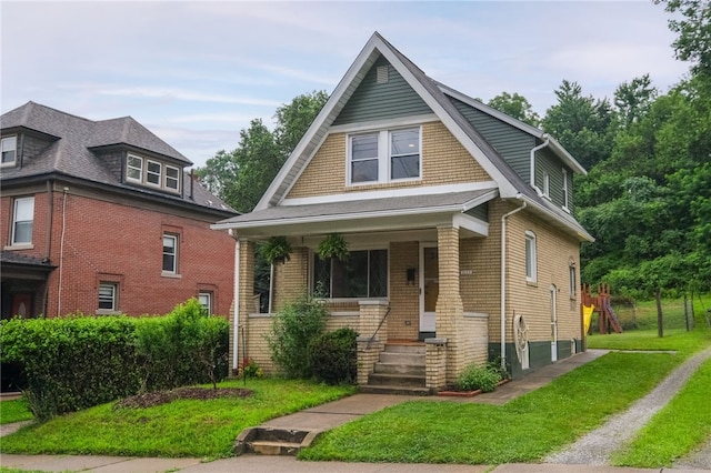 4329 Stanton Ave, Stanton Heights, PA 15201 - view of front of home featuring a front yard, a porch, and brick siding