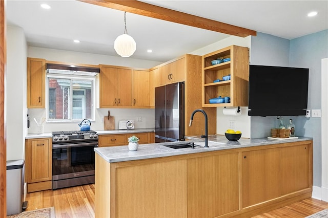 4329 Stanton Ave, Stanton Heights, PA 15201 - kitchen featuring gas stove, freestanding refrigerator, a peninsula, open shelves, and light wood finished floors