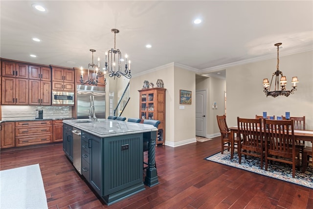3111 Edelweiss Ct Ste 201, Adams Twp, PA 16046 - kitchen with a chandelier, built in appliances, recessed lighting, decorative backsplash, and ornamental molding