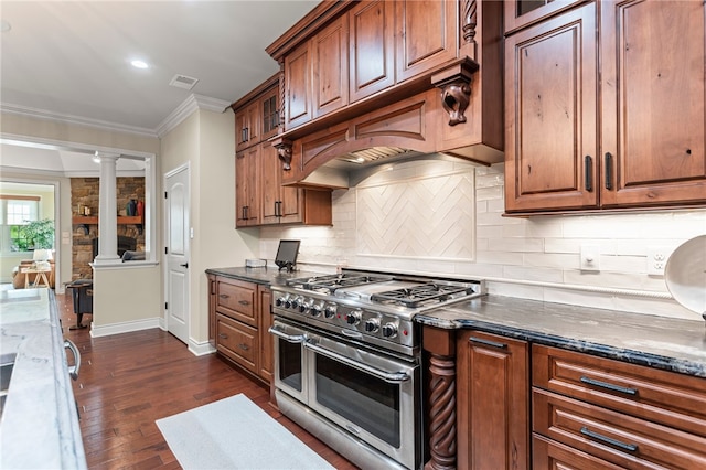 3111 Edelweiss Ct Ste 201, Adams Twp, PA 16046 - kitchen with range with two ovens, decorative columns, dark stone counters, crown molding, and backsplash