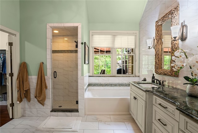 3111 Edelweiss Ct Ste 201, Adams Twp, PA 16046 - bathroom featuring vanity, a garden tub, a stall shower, marble finish floors, and a walk in closet