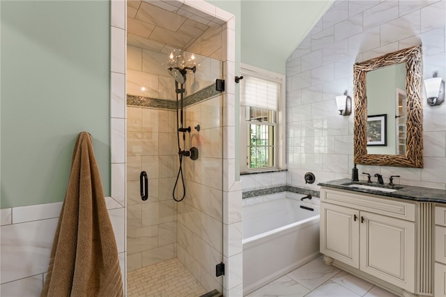 3111 Edelweiss Ct Ste 201, Adams Twp, PA 16046 - full bathroom featuring a bath, vanity, a shower stall, marble look tiles, and tile walls