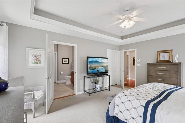 774 Norwegian Spruce Dr, Adams Twp, PA 16046 - bedroom with a raised ceiling, light colored carpet, connected bathroom, and a ceiling fan
