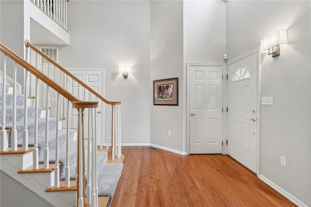 774 Norwegian Spruce Dr, Adams Twp, PA 16046 - foyer featuring a high ceiling, wood finished floors, and stairway