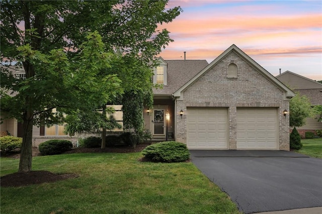 774 Norwegian Spruce Dr, Adams Twp, PA 16046 - view of front of house featuring driveway, brick siding, an attached garage, and a front lawn