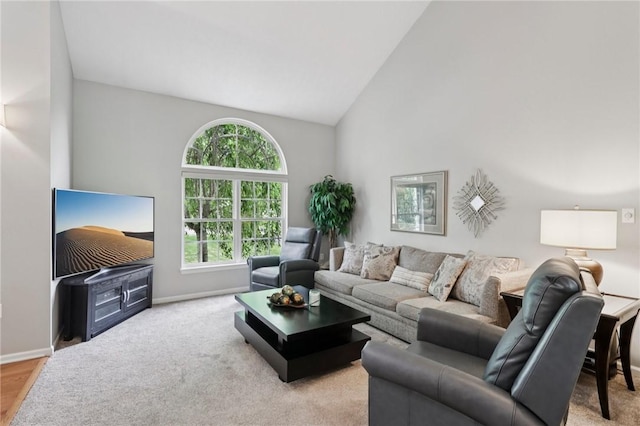 774 Norwegian Spruce Dr, Adams Twp, PA 16046 - carpeted living area featuring high vaulted ceiling and baseboards